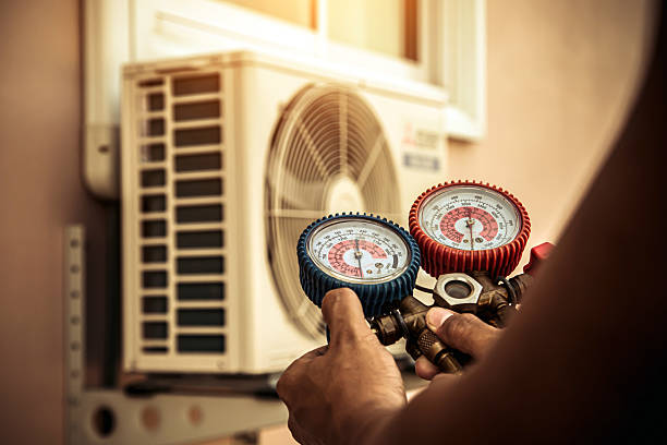 Professional Air Conditioning Service technician working in Millington, MI